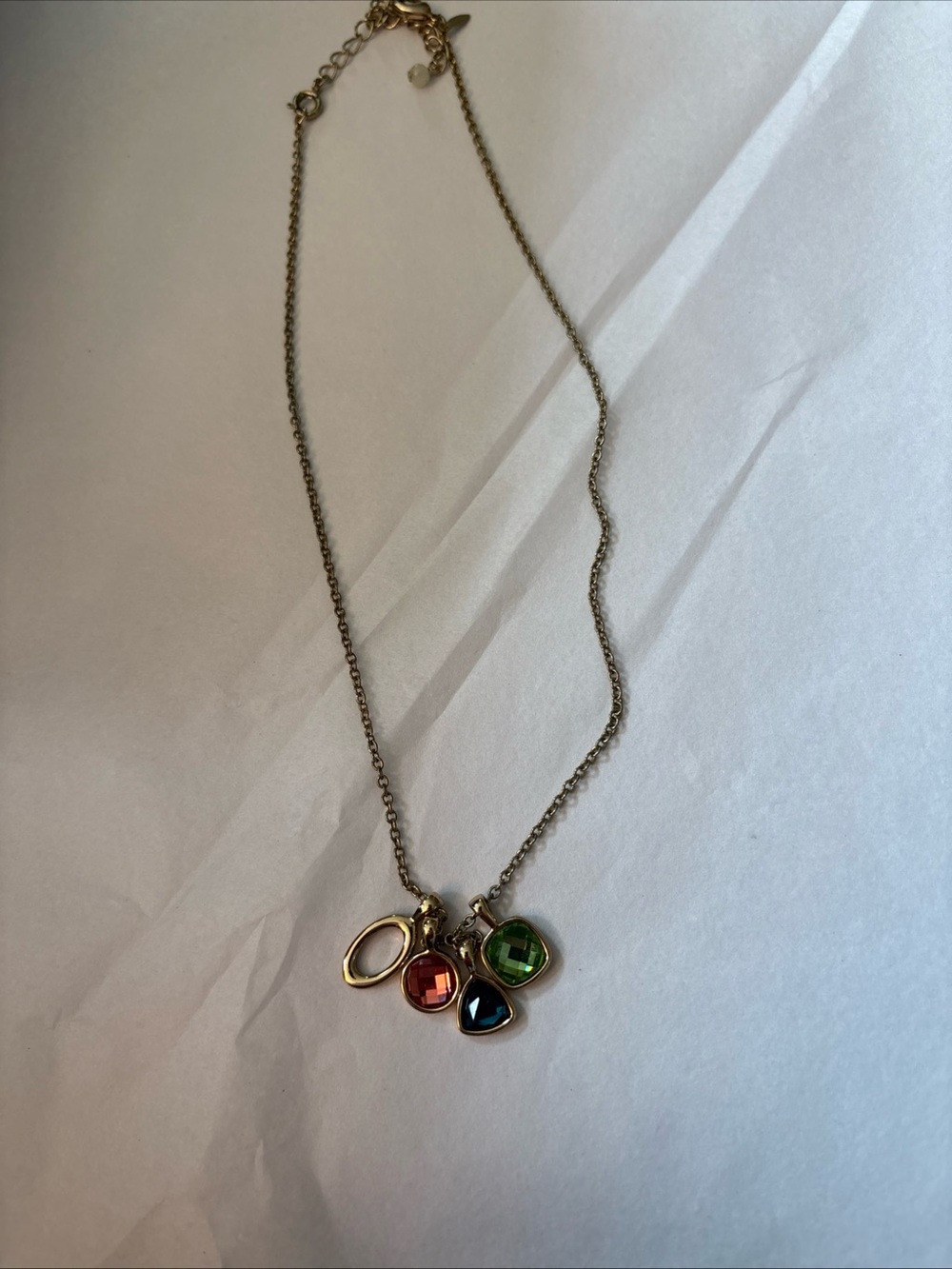 SHB Gold Tone necklace with 4 charms. 16” chain plus 3” extender.
